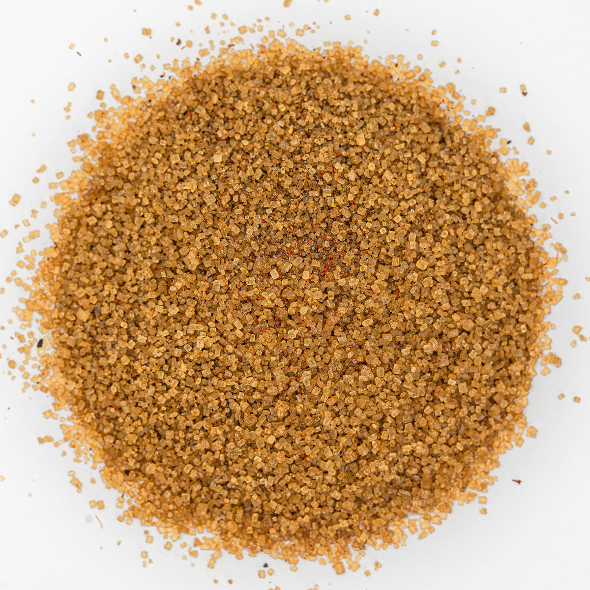Mound of golden salt with flecks of deep orange.