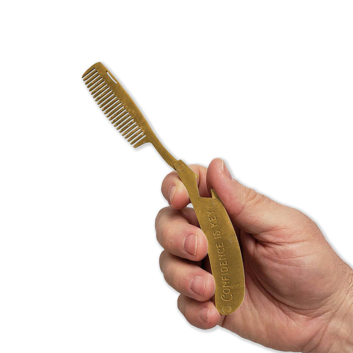 Hand holding a gold comb and spatula with 'CONFIDENCE KEY' branding on a white background