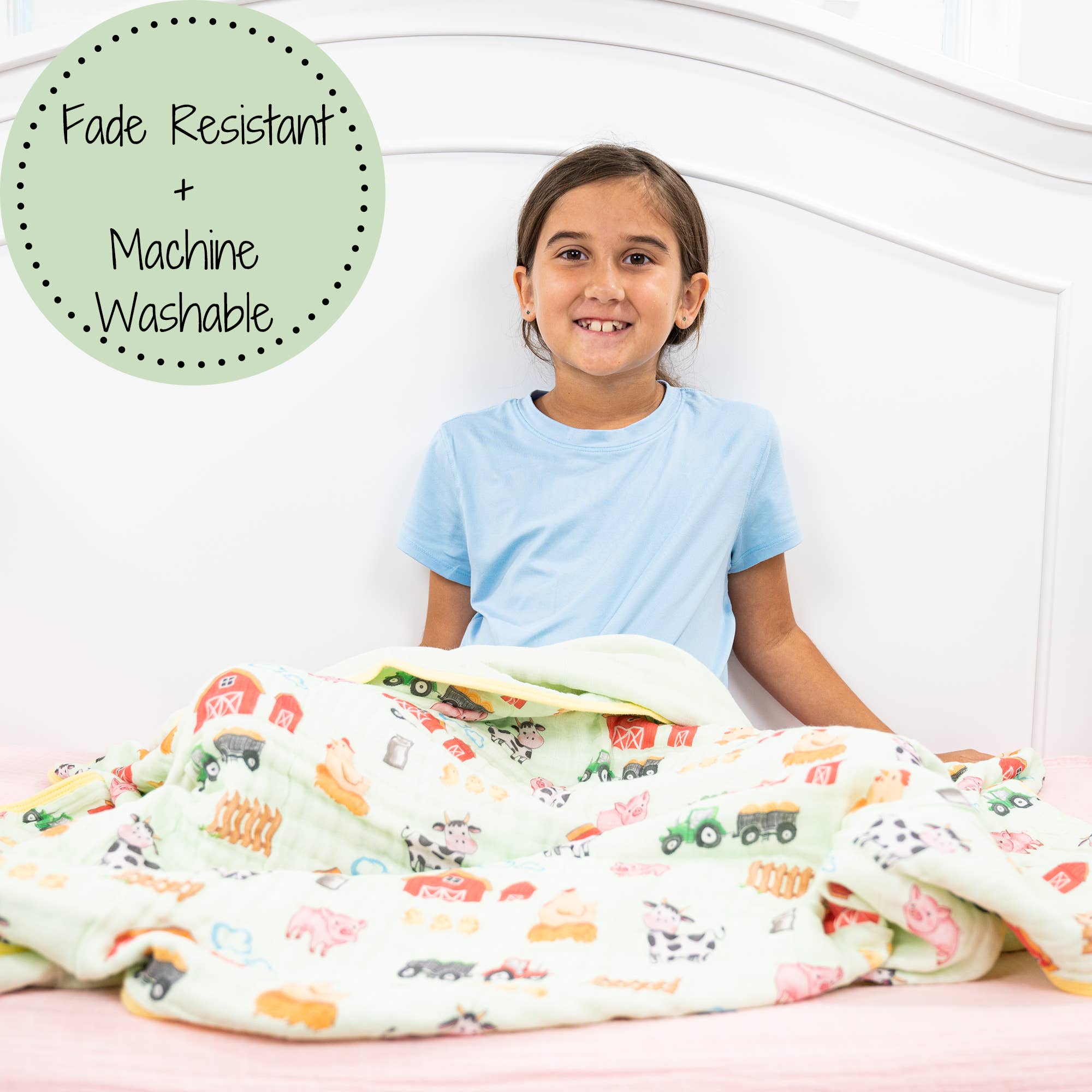 Child sitting on a bed with a colorful patterned blanket, text 'Fade Resistant + Machine Washable' in the corner.