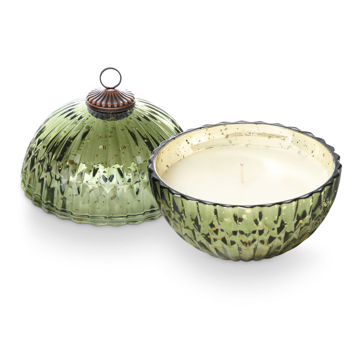 Green glass ornament candle with textured surface and metallic top on a white background