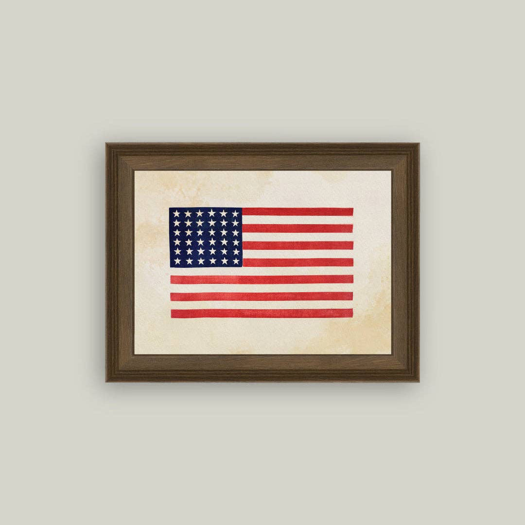 A timeless piece of American history, this Thirty-Six Star Flag brings warmth and character to any room. The handcrafted ornate frame adds classic charm, while the premium canvas fabric captures the texture and authenticity of antique art. At 16"x12", it's the perfect size to make a meaningful statement without overwhelming your space. This piece celebrates heritage with care—printed on quality canvas, framed by hand, and made right here in the USA. The glass-free design keeps it lightweight.