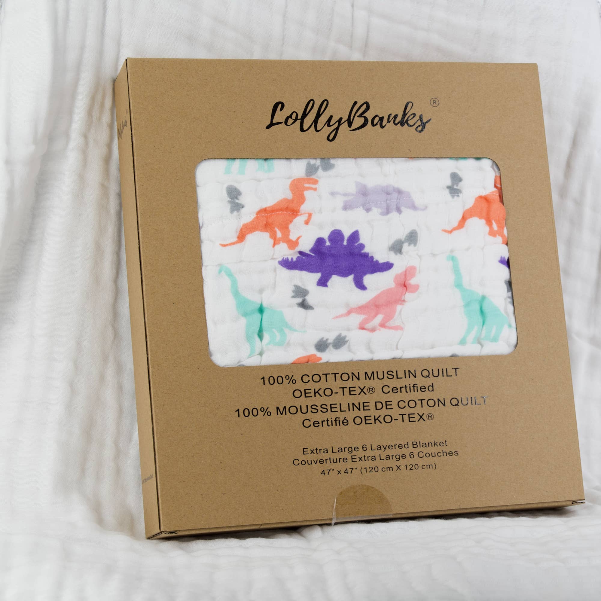 LollyBanks muslin quilt packaging with dinosaur pattern on a white background