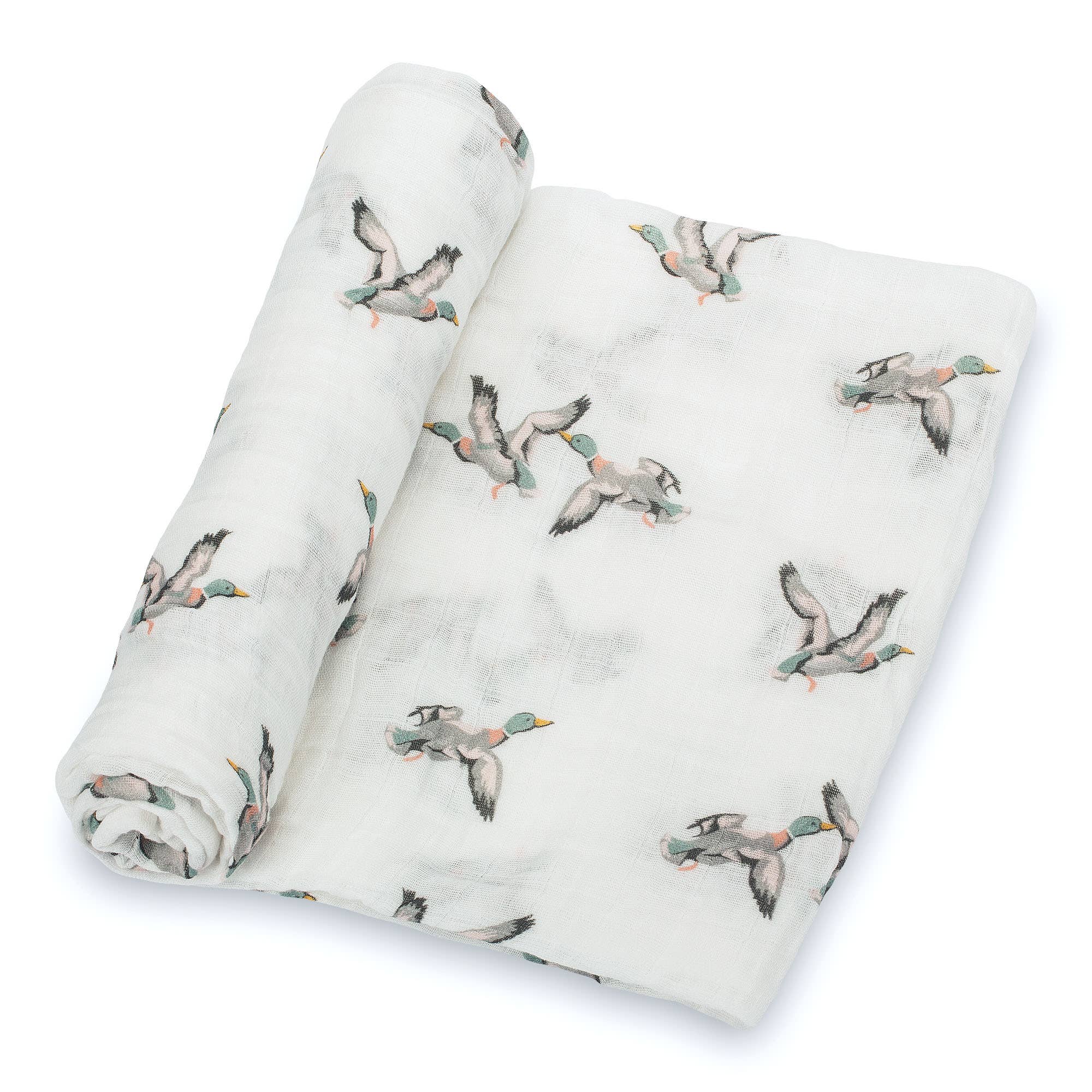 Rolled up blanket with duck pattern on a white background