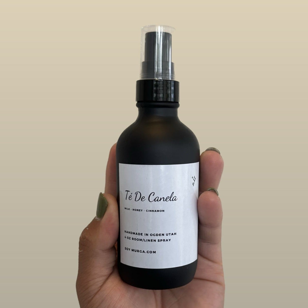 Te De Canela room spray in a dark amber bottle.