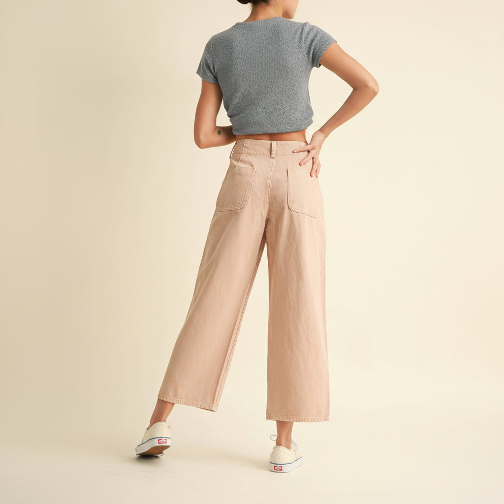 Classic cotton pants with a refined button front detail. Crafted from soft, breathable cotton for everyday comfort and versatility. The tailored fit flatters while allowing ease of movement, making these pants perfect for casual outings or dressed-up occasions. Available in a sophisticated mauve tone that pairs effortlessly with any wardrobe staple.