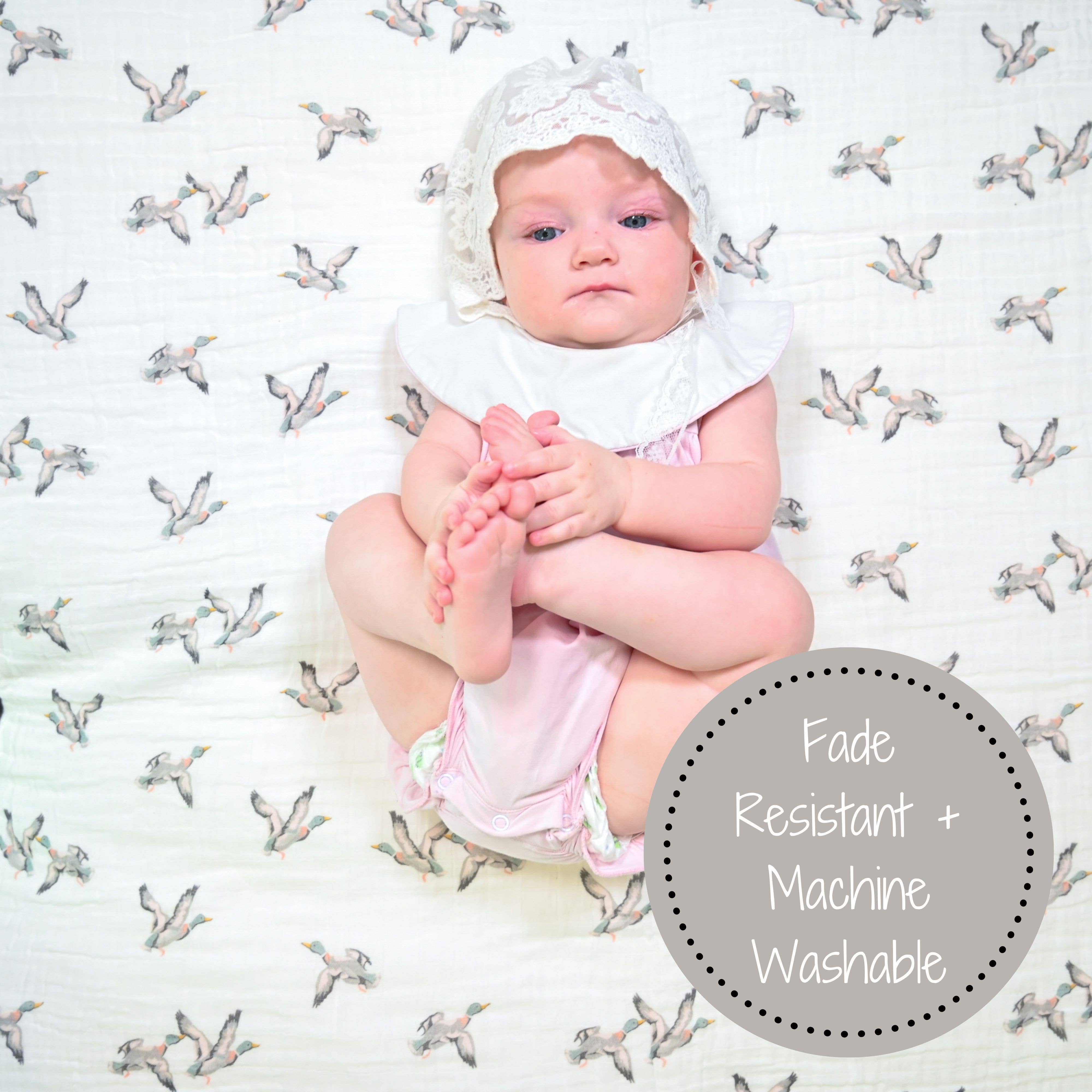 Baby sitting on a patterned surface with text 'Fade Resistant + Machine Washable'.