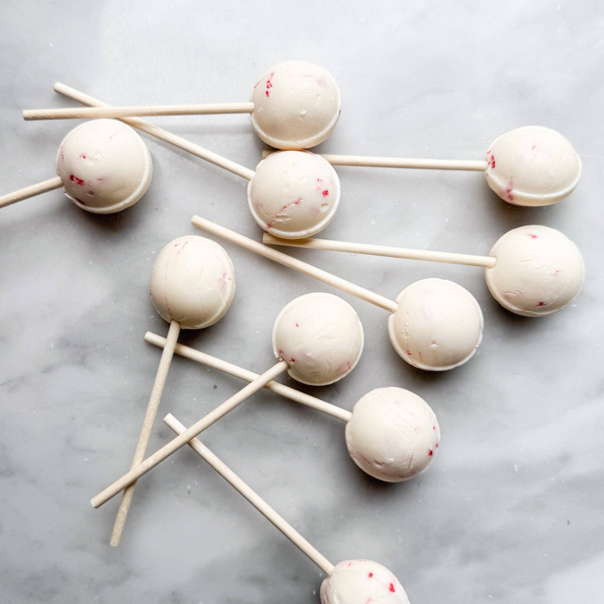 Our Peppermint Crunch lollipop is a deliciously creamy treat that combines the smoothness of vanilla with the refreshing zing of peppermint. Each lollipop is thoughtfully studded with crunchy peppermint chunks, offering a delightful texture and flavor experience.
Details:
Made in the USA, our candy is all American candy—made in small batches by our talented candy makers
Ingredients: sugar, glucose, water less than 2% of citric acid, food coloring, artificial/natural flavoring, vegetable glycerin.