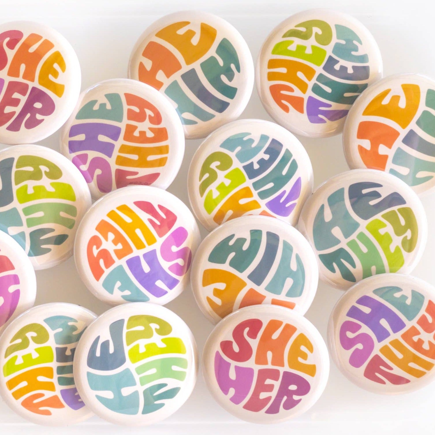 Wear your pronouns with pride with these cute retro-style buttons! This pinback button displays "He/Him" pronouns in a colorful palette. It is the perfect way to let others know how to address you and to show your support for the LGBTQ+ community! Size: 1.25" pinback button