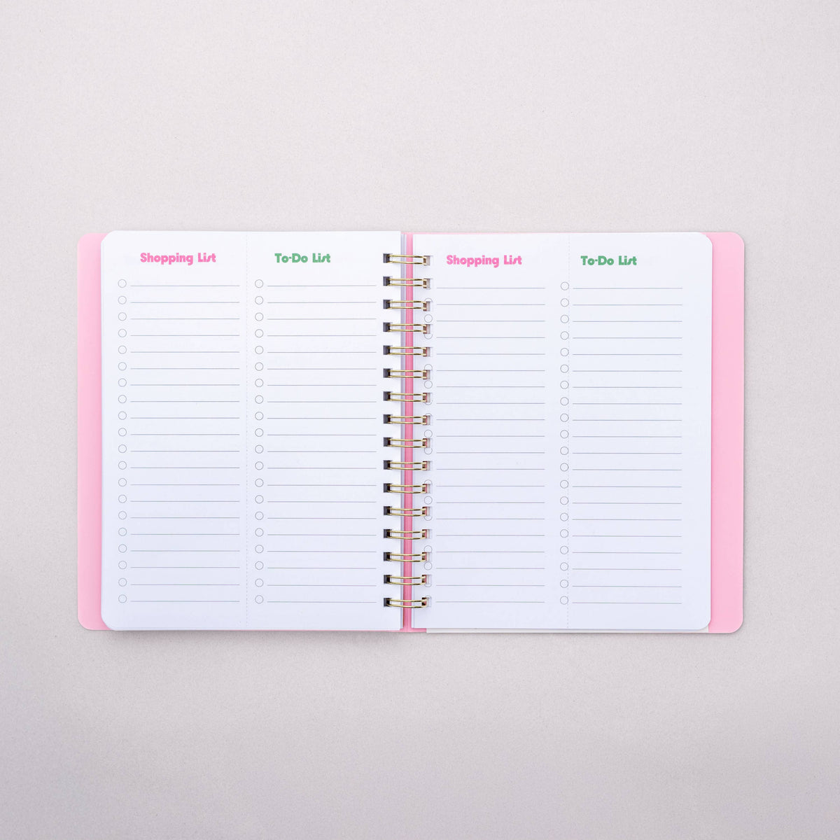 Open notebook with lined pages on a light gray background