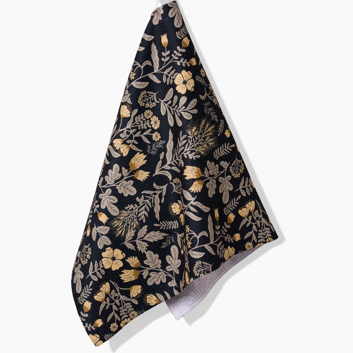 black tea towel with yellow/green floral pattern
