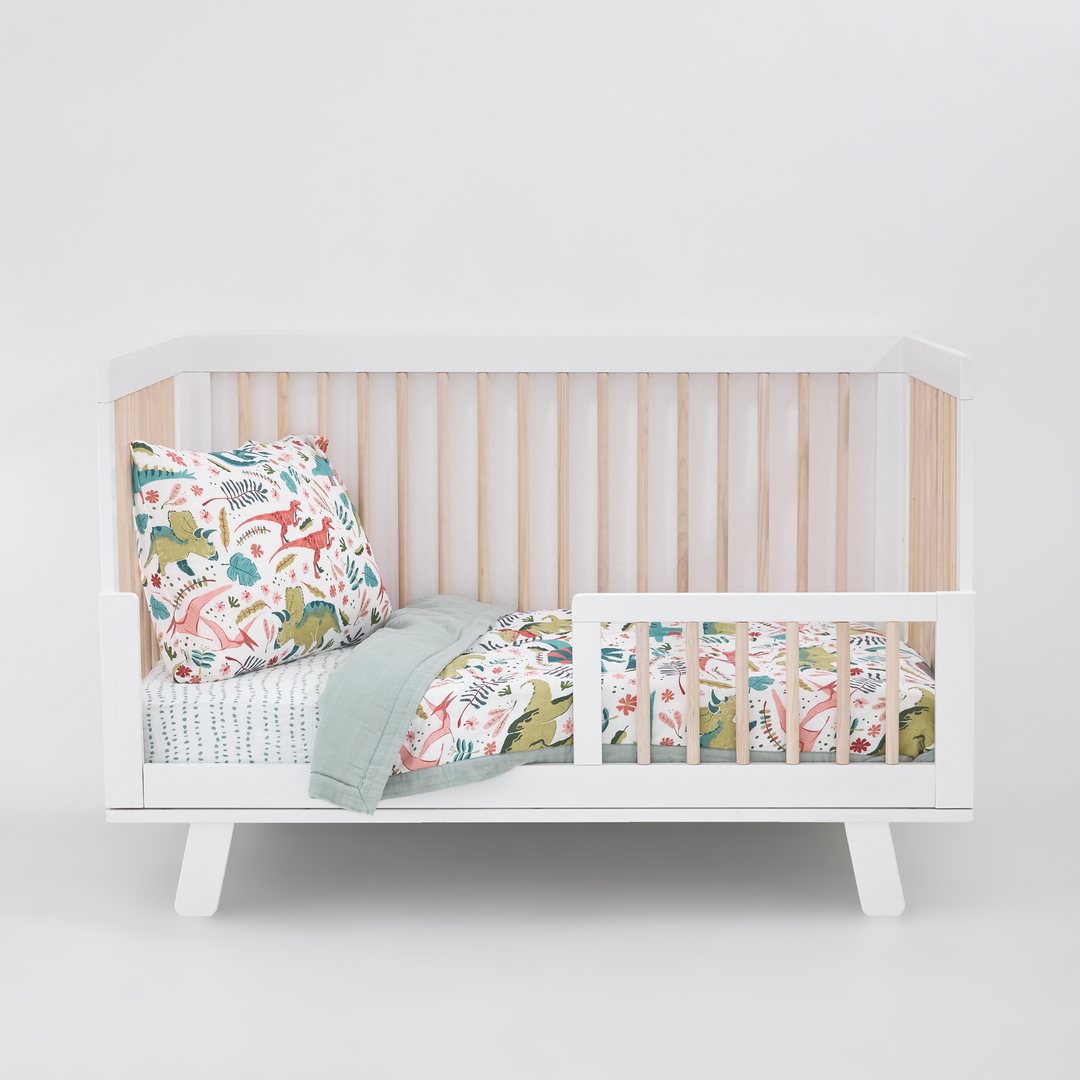 Celebrate their imagination. The Toddler Bedding Set features a variety of themes and prints to help bring their creativity to life as they transition from infant to toddler. 3 piece set includes: 1 Toddler Comforter, 1 crib sheet, 1 pillowcase. Cotton Muslin Toddler Bedding 3 Piece Set - Boho Dino