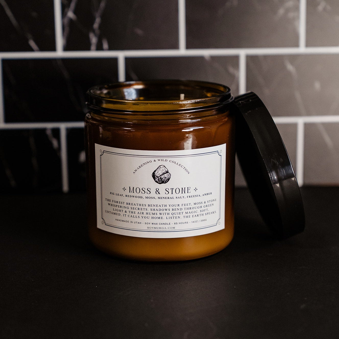 14 oz Moss & Stone double wick in an amber glass jar.