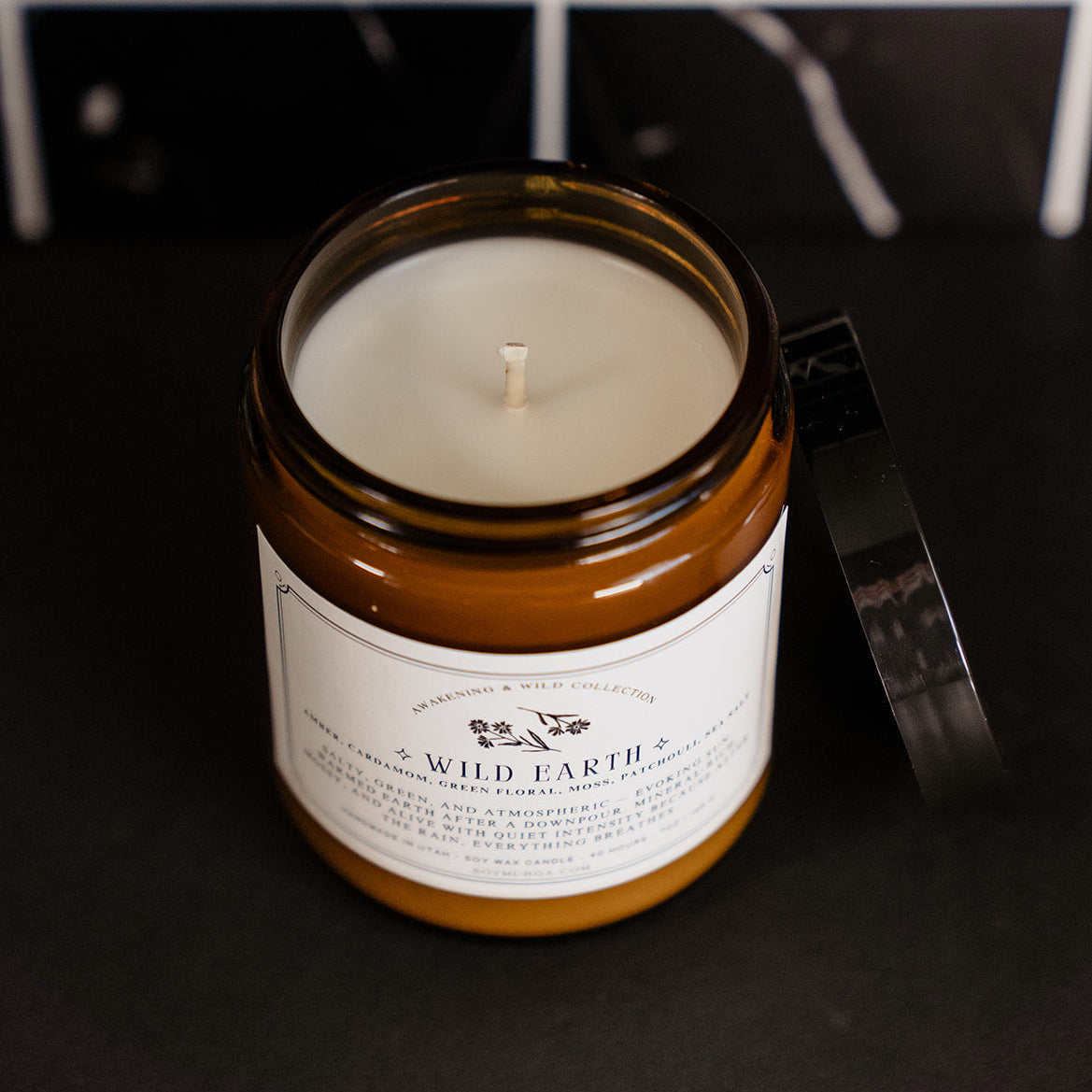 The Wild Earth candle in an amber jar.