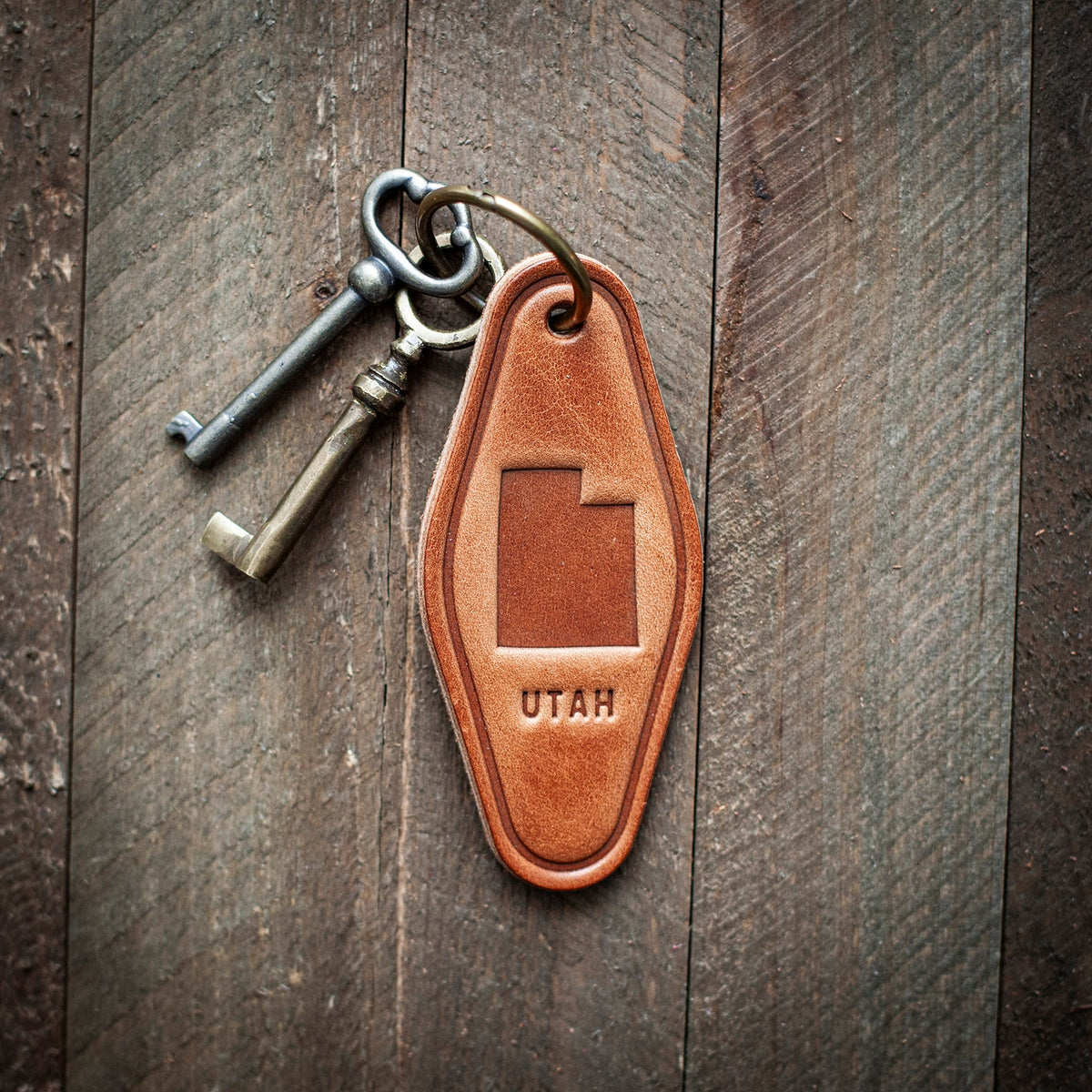 This Utah themed leather keychain comes in a classic motel style. Our leather keychains are cut and pressed by hand from some of the thickest and finest harness leather available, and patina beautifully as they age.
Size: 4”
Hardware: Antique Bronze 1 inch hinged keyring