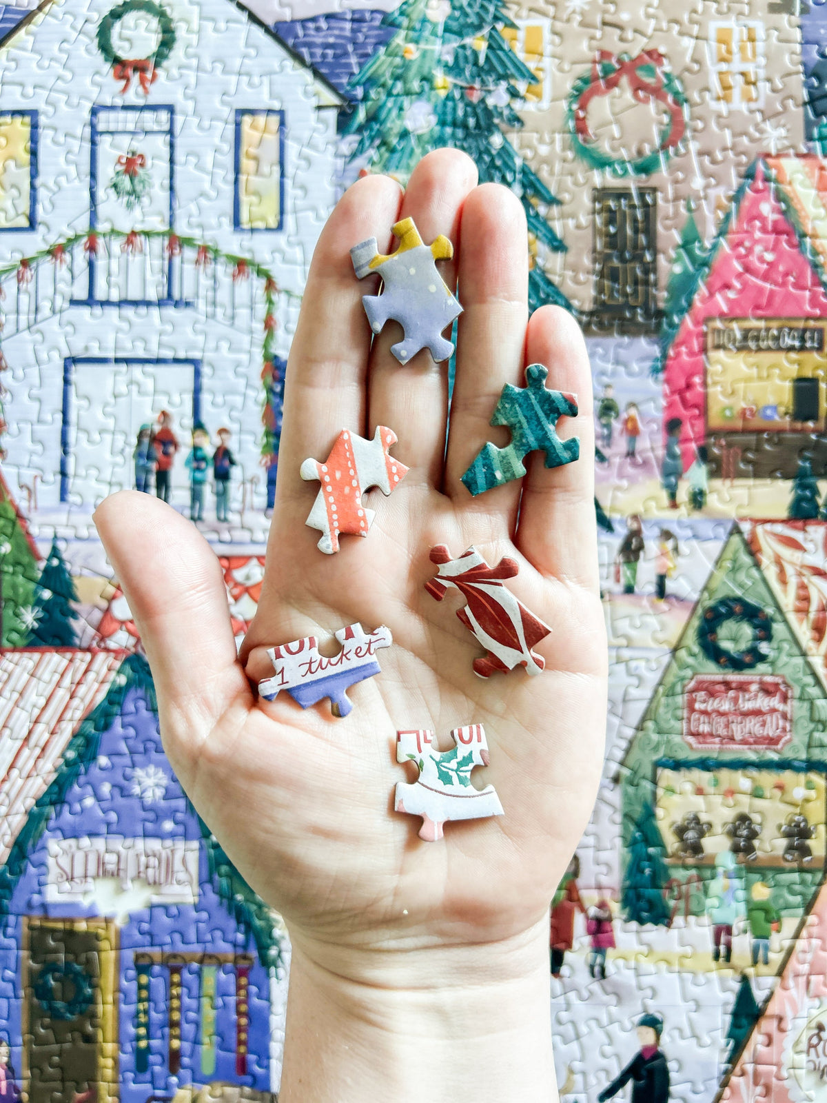 random puzzle pieces in hand.