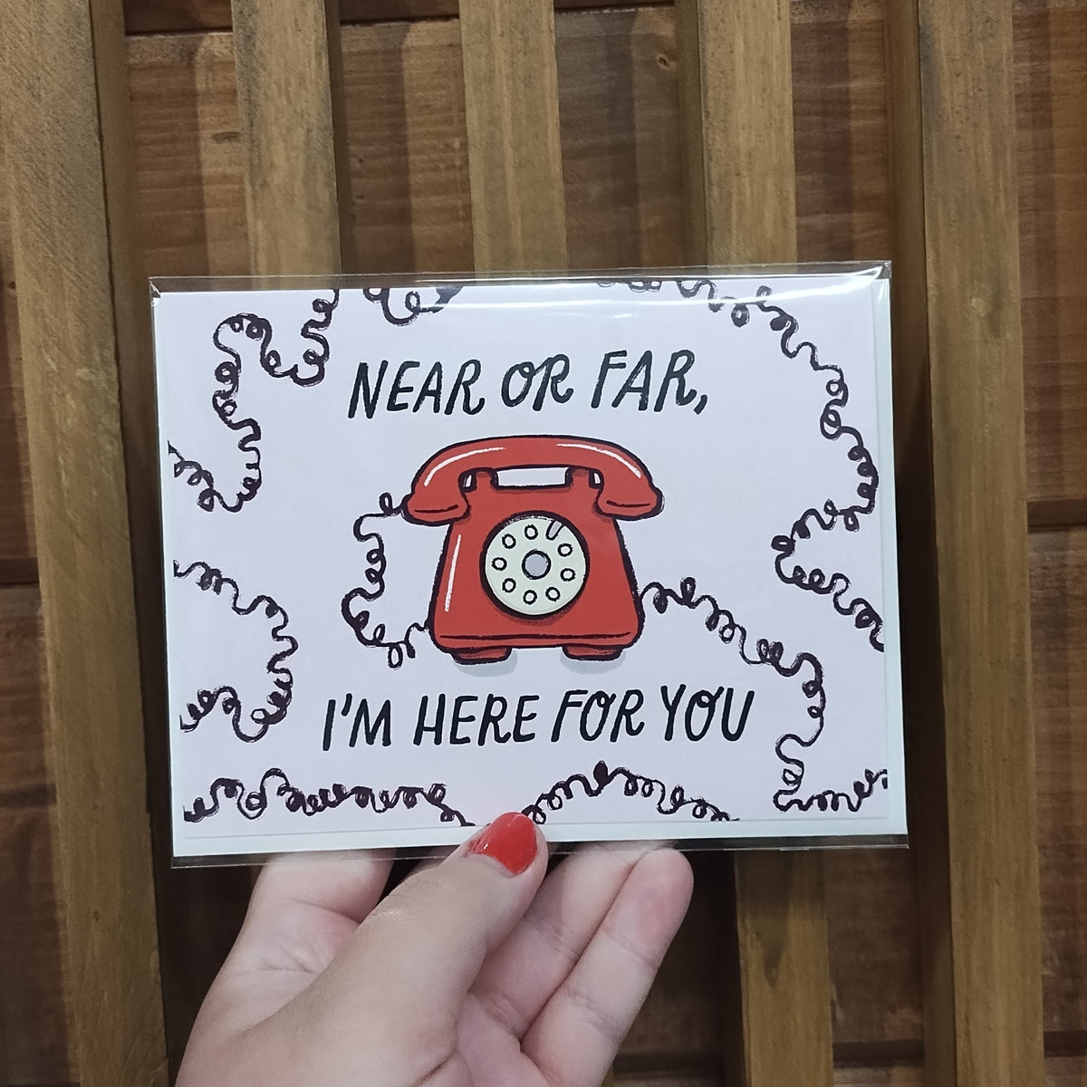 Light purple card with lots of curly cord and a red retro phone in design. Words say Near or Far, I'm Here For You!