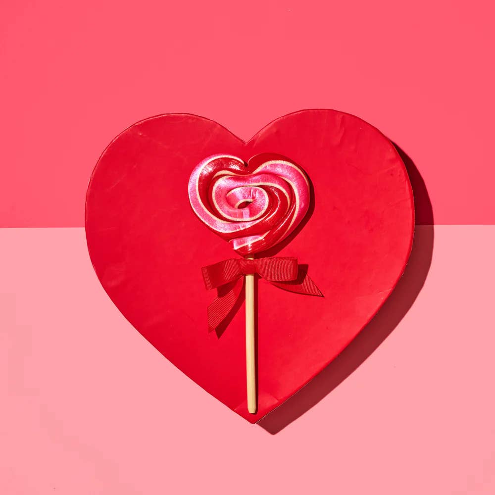 Hammond’s Heart-Shaped Wild Cherry Lollipop brings classic cherry flavor to a playful new format, delivering bold, juicy sweetness with every bite. The heart shape adds instant charm for Valentine’s Day and gives a romantic, whimsical and nostalgic feel. Handmade with care in Denver, Colorado, Hammond’s lollipops are individually pulled, twisted, and packaged by hand using traditional techniques. Crafted on real wooden sticks and offered in an array of vivid colors and inventive flavors.