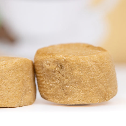 Two brown cylindrical objects on a white background