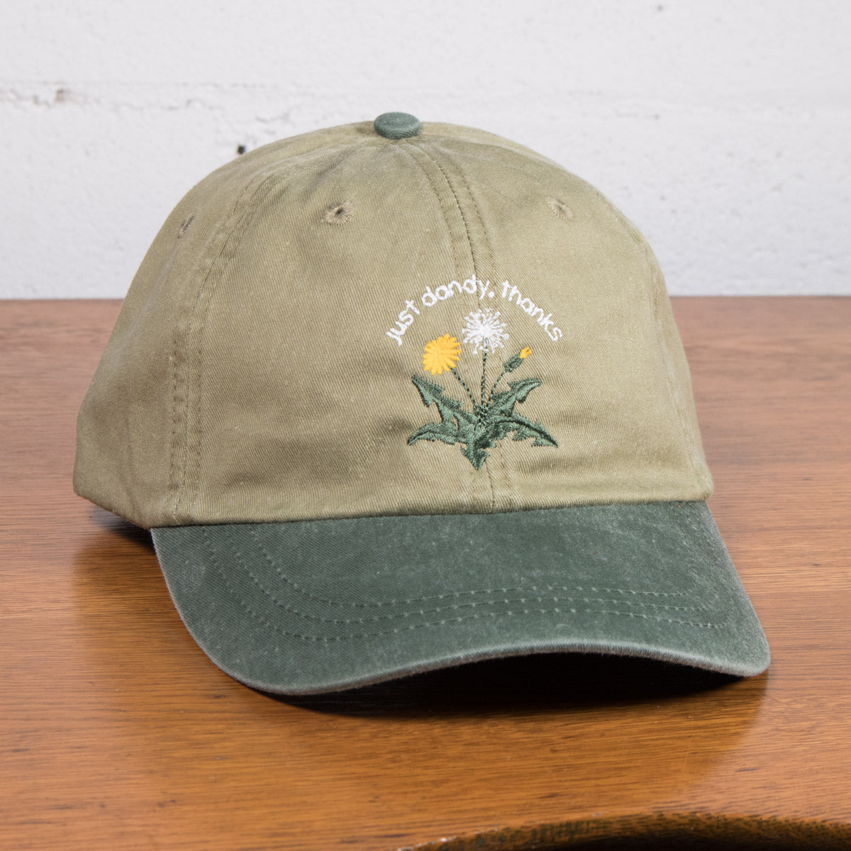 The "Just Dandy, Thanks" Hat is about existing even when others might see you as an outsider. Dandelions are much more than just a weed, so whether you’re a “black sheep” or simply “not like the others,” this cap says: "I’m thriving and I'm doing just dandy, thanks!"
Made for sunny strolls, casual hangs, and moments worth smiling about.
Details:
Playful Embroidery of a dandelion thriving
100% cotton dad cap with a breathable mesh lining
Adjustable leather strap, one size fits most