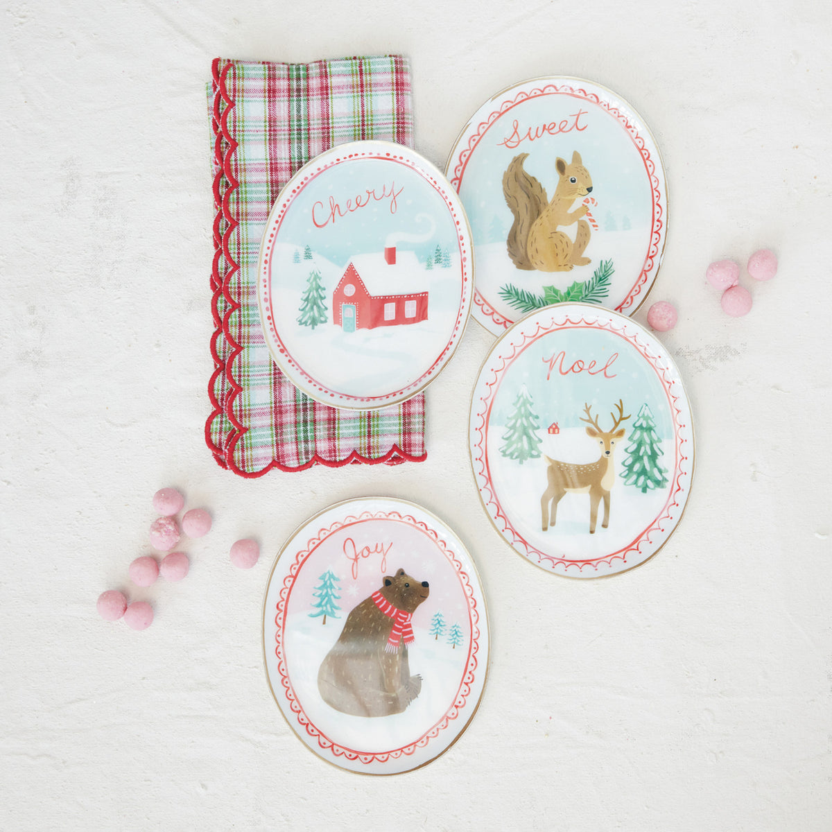 Bring a touch of cozy festive charm to your home with our Storybook Holiday Tray. Beautifully crafted from enameled metal with elegant gold edges, this lovely piece is perfect for serving holiday treats or displaying seasonal accents to make your gatherings feel extra special.