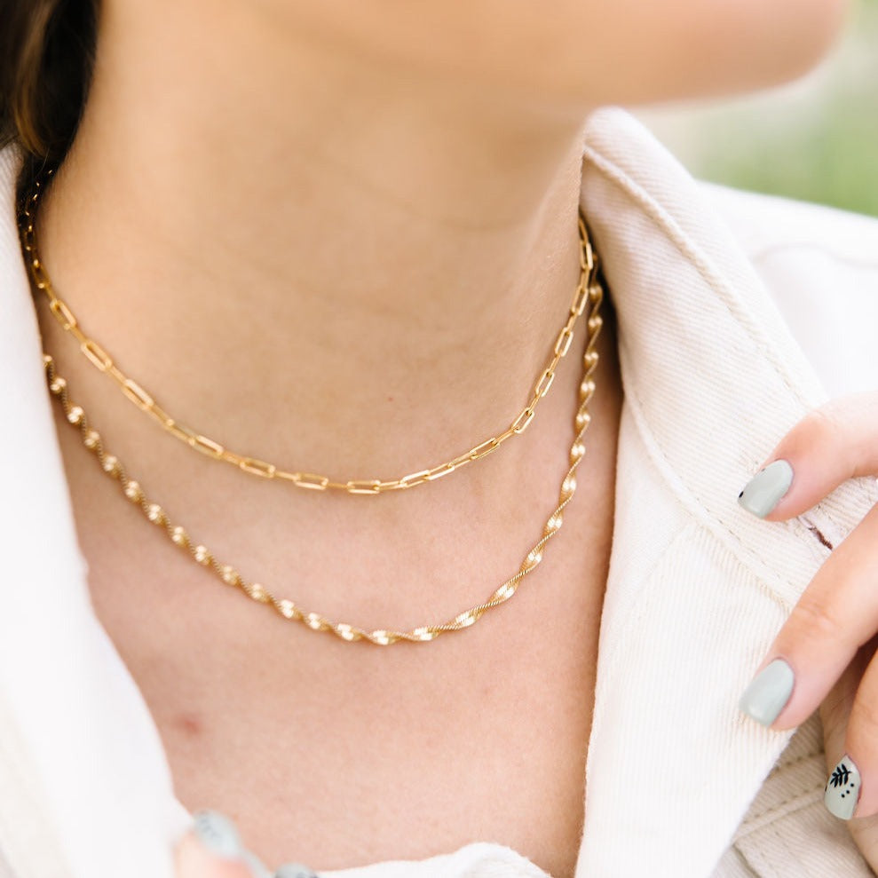 The Amelia Gold Filled Twist Necklace is the perfect piece to stack with other necklaces or wear as a stand alone accessory. She’s 18k gold filled, tarnish and wear resistant, and made to last. Hypoallergenic and nickel free, this unique and dainty 3mm chain is the perfect accessory all year long. 16" length.