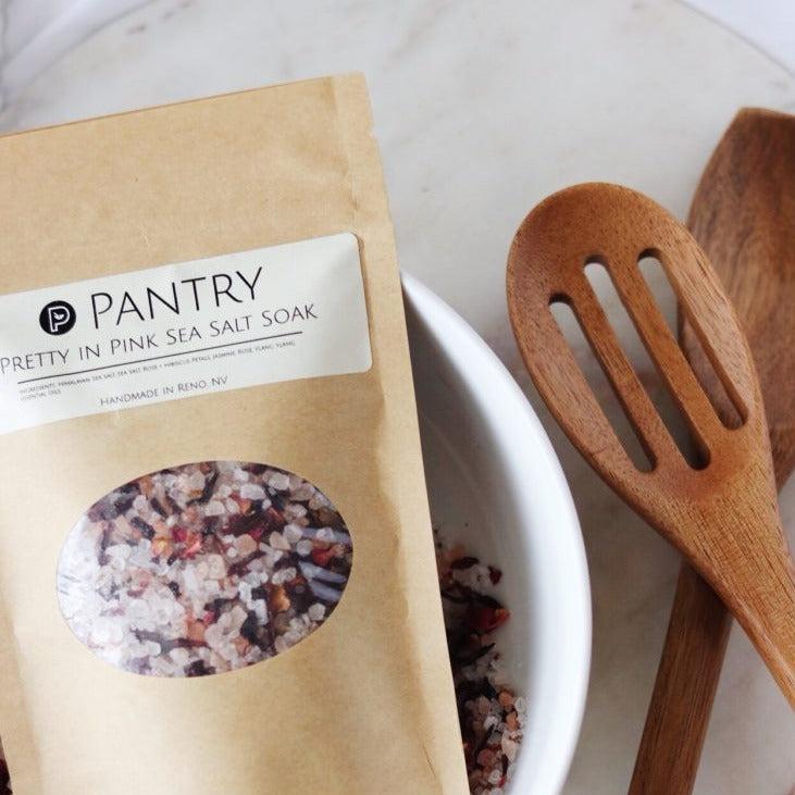 brown bag with pretty in pink sea salt soak