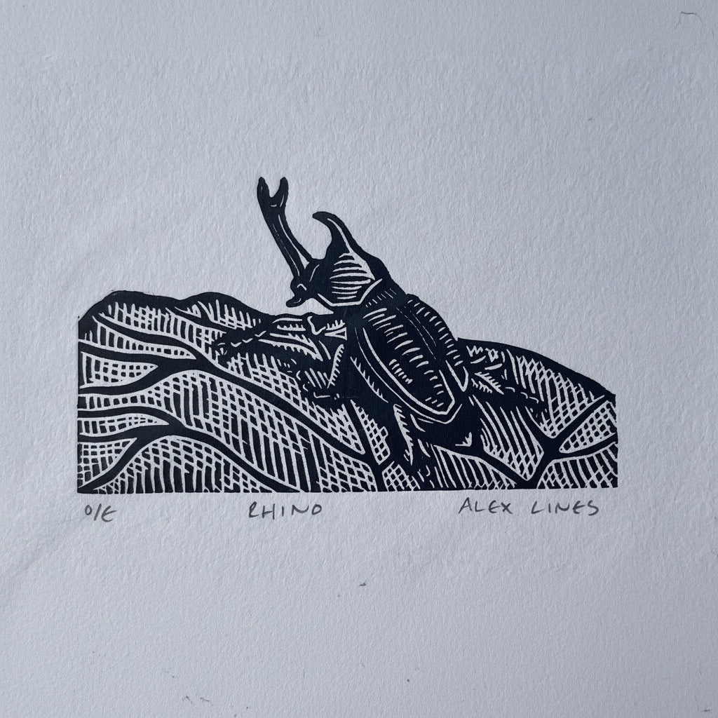 This striking linocut print captures the magnificent Rhino Beetle in bold, graphic detail. Hand-carved linoleum creates dramatic contrasts and intricate textures that bring this armored insect to life. Perfect for nature lovers, art collectors, and anyone who appreciates the quirky beauty of the natural world. Each print showcases the unique character of traditional printmaking, making it a conversation-starting addition to any space. Frame it solo or pair it with other wildlife prints for an eclectic galle
