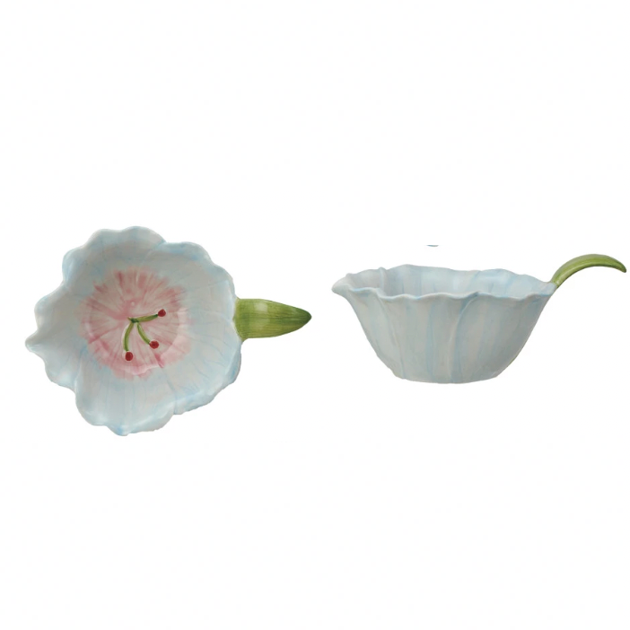 Add a touch of whimsy to your home with our hand-painted stoneware flower-shaped bowl! Perfect for small snacks or holding jewelry, this bowl is both charming and functional. Spruce up your decor with this unique piece. 6-3/4"L x 4-3/4"W x 3-1/4"H