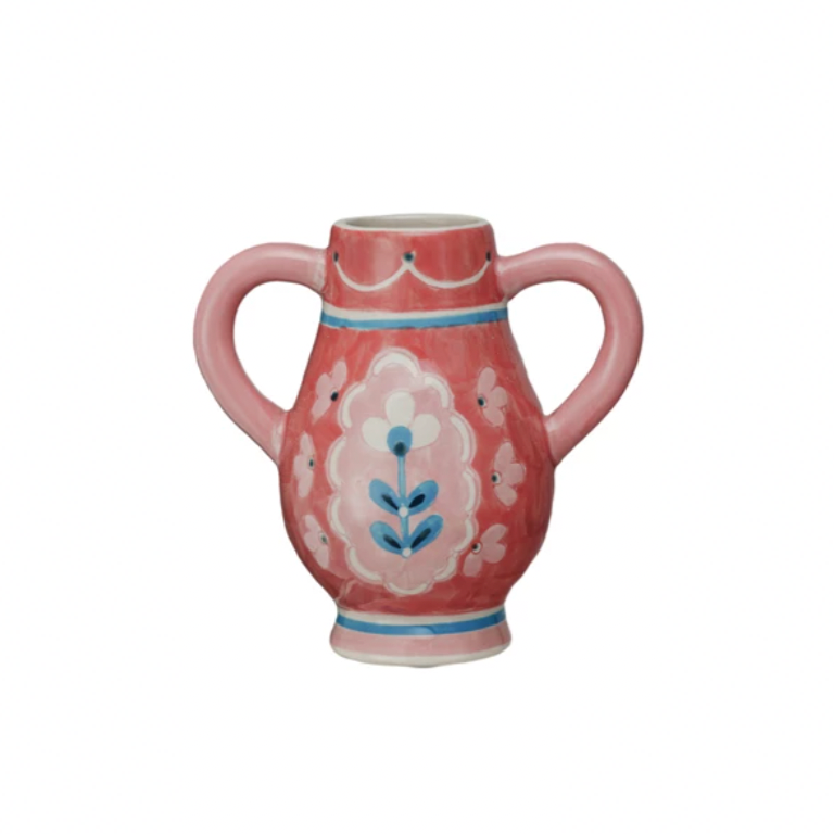 This Hand-Painted Stoneware Urn with Flower, Stripes, and Handles is a celebration of artistry and color. Its multi-colored palette includes a range of hues that complement its unique design. The urn's other shape sets it apart, offering a fresh take on traditional vases. Influenced by Scandinavian, Boho, and French Country styles, it serves as a versatile decor piece