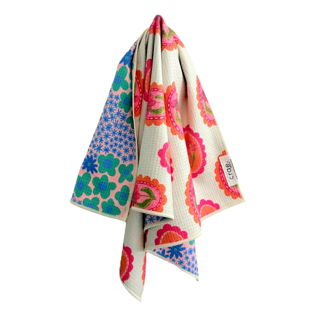 Colorful floral-patterned towel on a white background