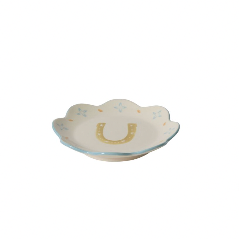 Decorative plate with a horseshoe design on a white background