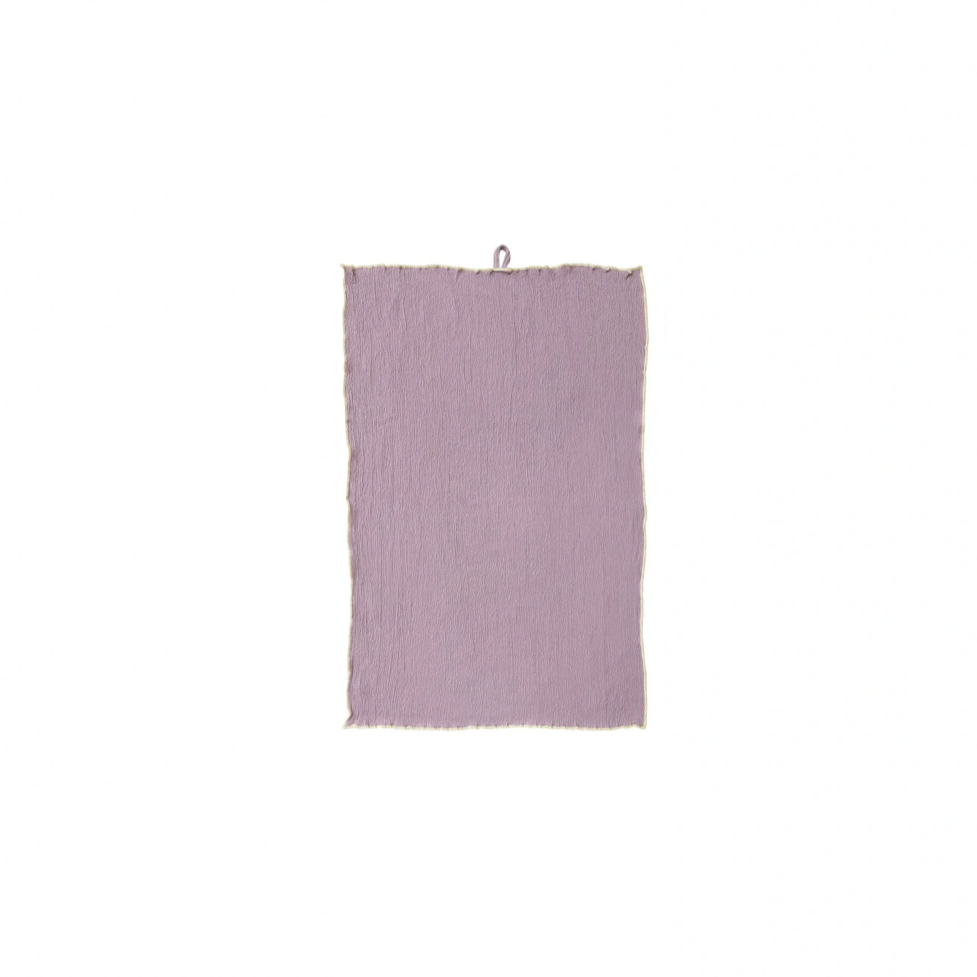 Purple textured towel on a white background