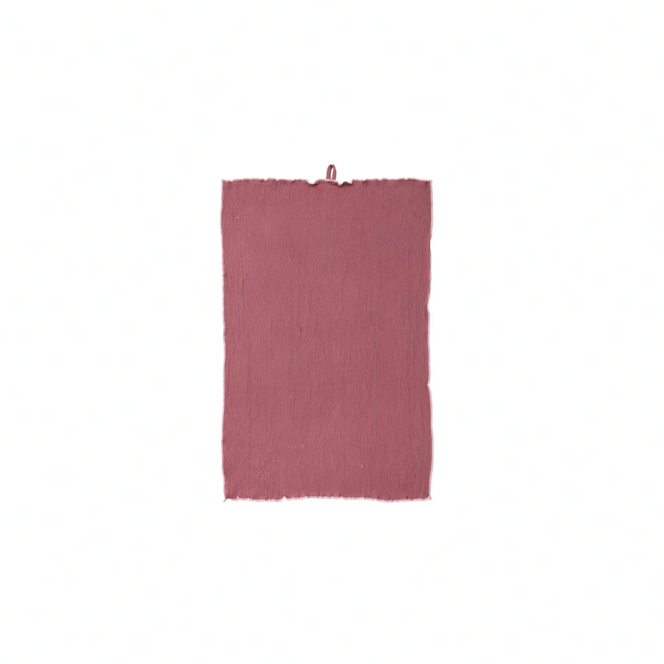 Mauve-colored towel on a white background