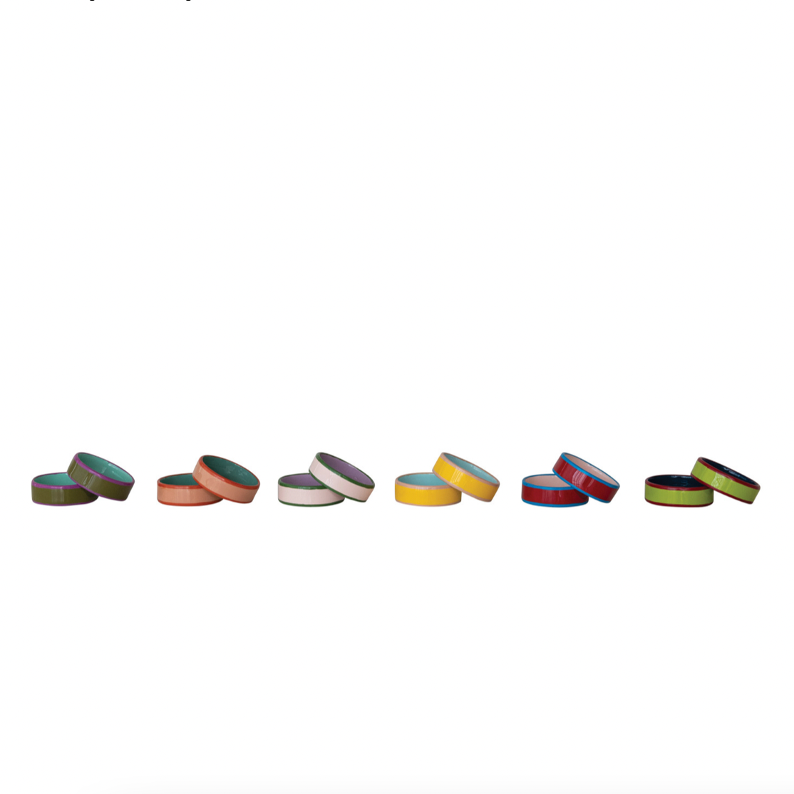 Colorful napkin rings arranged in a row on a white background