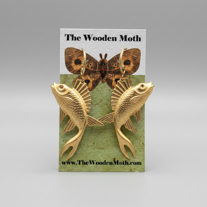 Handcrafted brass earrings featuring a striking large bass fish design. Each pair showcases meticulous metalwork and natural patina, perfect for nature lovers and fishing enthusiasts. The Wooden Moth brings artisanal detail to wearable art—ideal for adding character to any collection.
