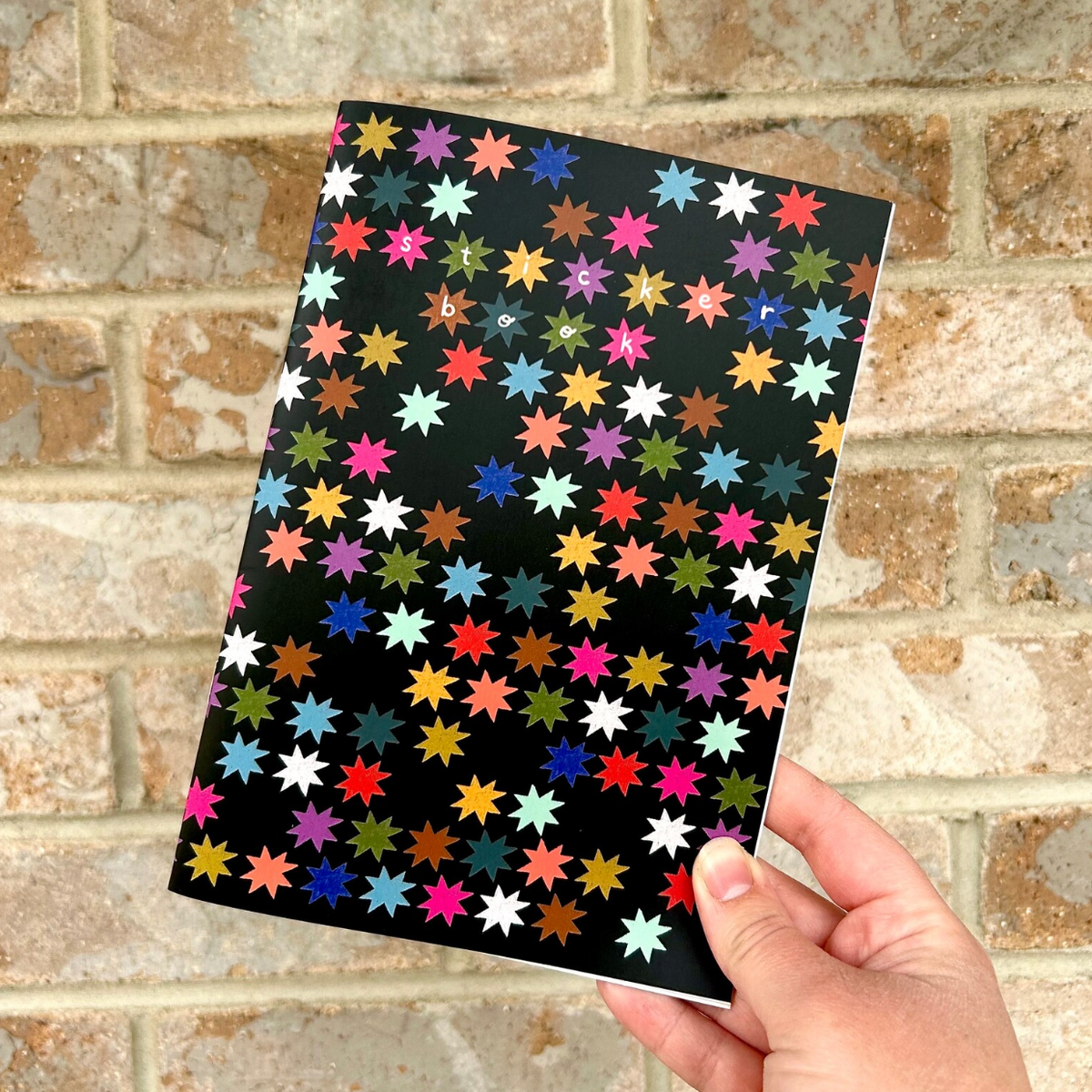 Colorful Stars on Black Sticker Book