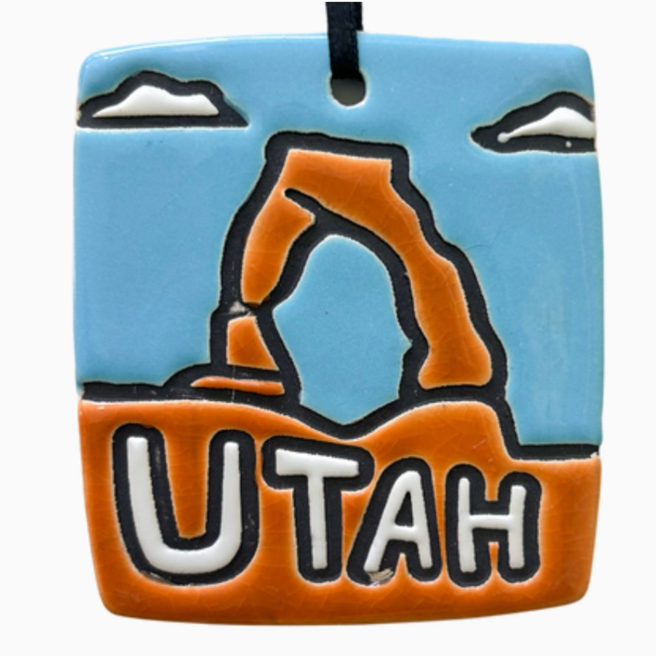 Ceramic ornament featuring Utah's iconic delicate arch.