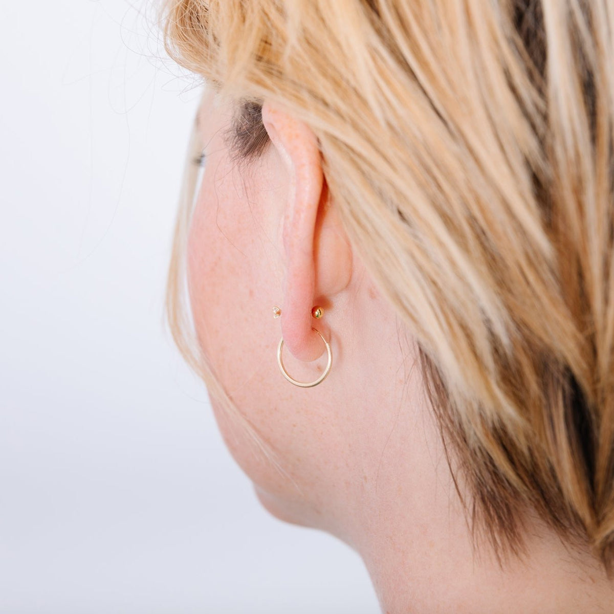 The unique post of a screw back earring screws into a tiny bead in the back of the ear. This tiny screw means no poking, no messing with, no losing earring backs. The earring is completely secure and doesn't hurt your neck with its annoying pokes. Screw back earrings are comfortable to sleep in and just don't need to be messed with. Nap all you want in these beauties!