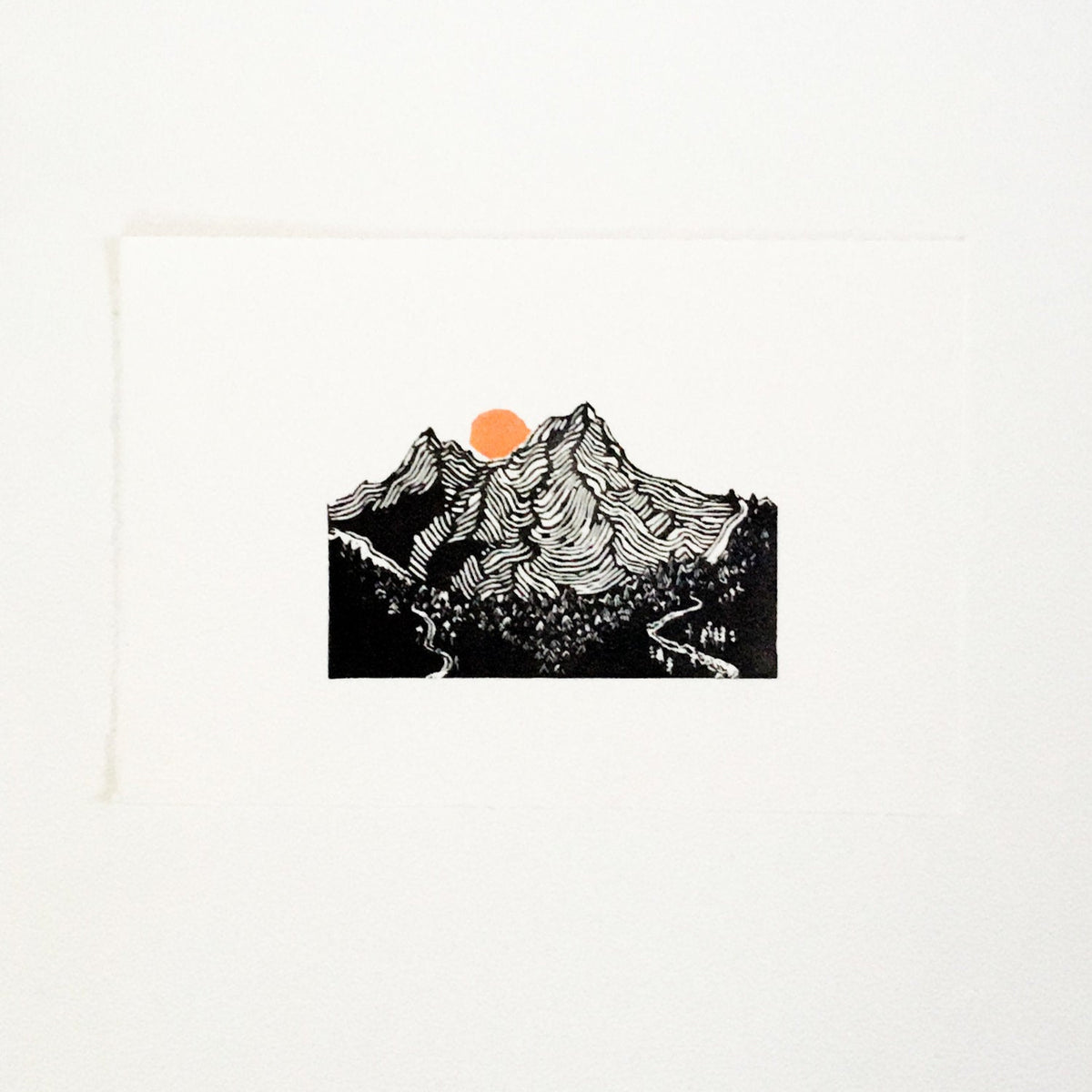 hand carved and pressed black and white 11x14 print of 2 of the 3 sisters mountain range with an orange sun