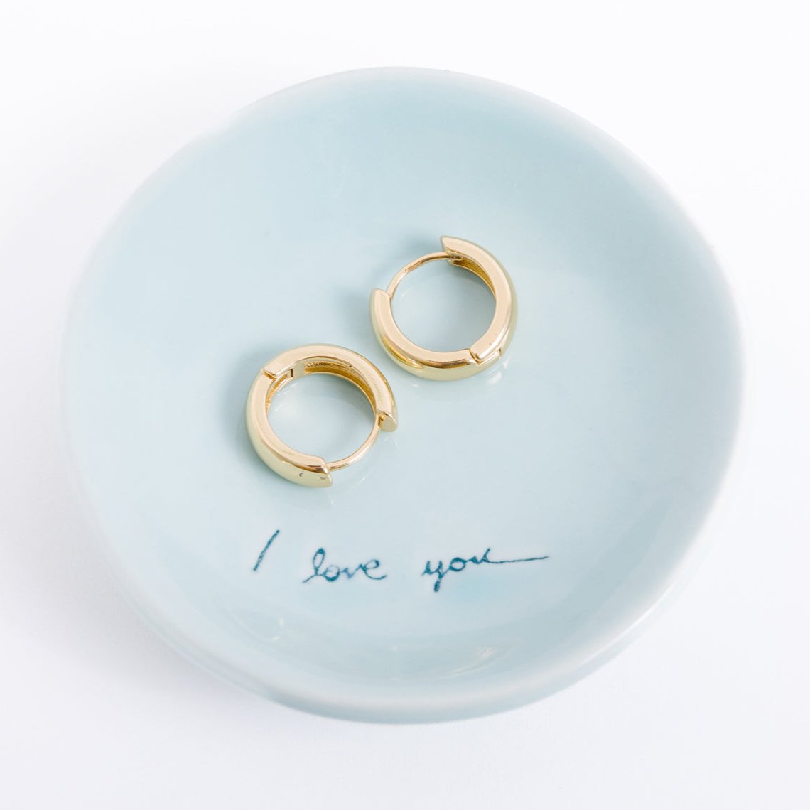 14k gold filled. Safe for sensitive skin. Unique clasp has no post when earrings are closed, allowing for comfortable wear and sleep without having to remove earrings. Available in 9 mm and 16 mm, Hypoallergenic, While gold filled is a strong, sturdy metal for maximum lifespan we don't recommend subjecting the earrings to lots of chemicals, waters, perfumes, etc.