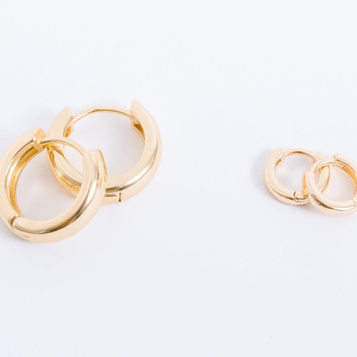 14k gold filled. Safe for sensitive skin. Unique clasp has no post when earrings are closed, allowing for comfortable wear and sleep without having to remove earrings. Available in 9 mm and 16 mm, Hypoallergenic, While gold filled is a strong, sturdy metal for maximum lifespan we don't recommend subjecting the earrings to lots of chemicals, waters, perfumes, etc.