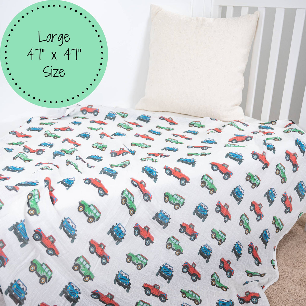 Children's bedding with truck pattern on a bed with striped headboard
