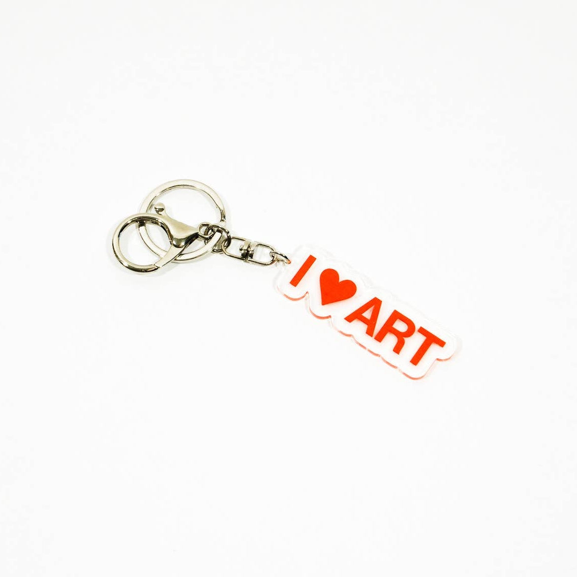 Keychain with 'I ❤️ ART' text on a white background