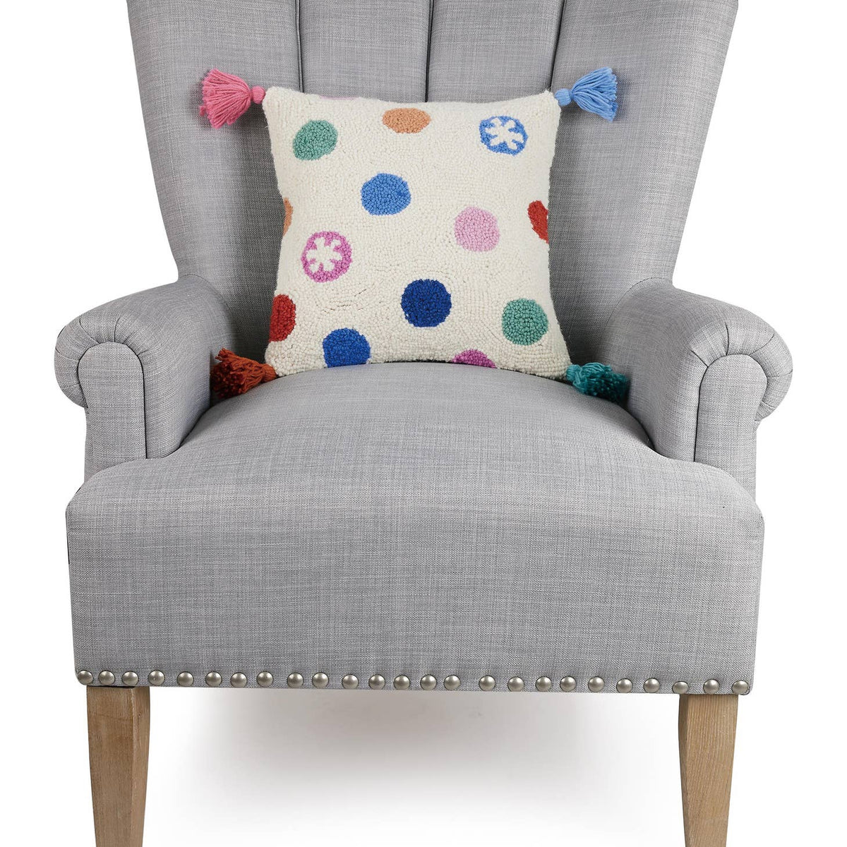Dress up any room with this dotty delight! This Dots W/Tassels Hook Pillow adds personality and pizzazz with its playful dot pattern and tassel accents. Who knew dots could be so stylish? (Seriously, though - this pillow is seriously cute!) Description 100% wool hooked rectangular accent pillow 100% cotton velvet backing Includes polyester insert, zipper closure Size 14x14 inches