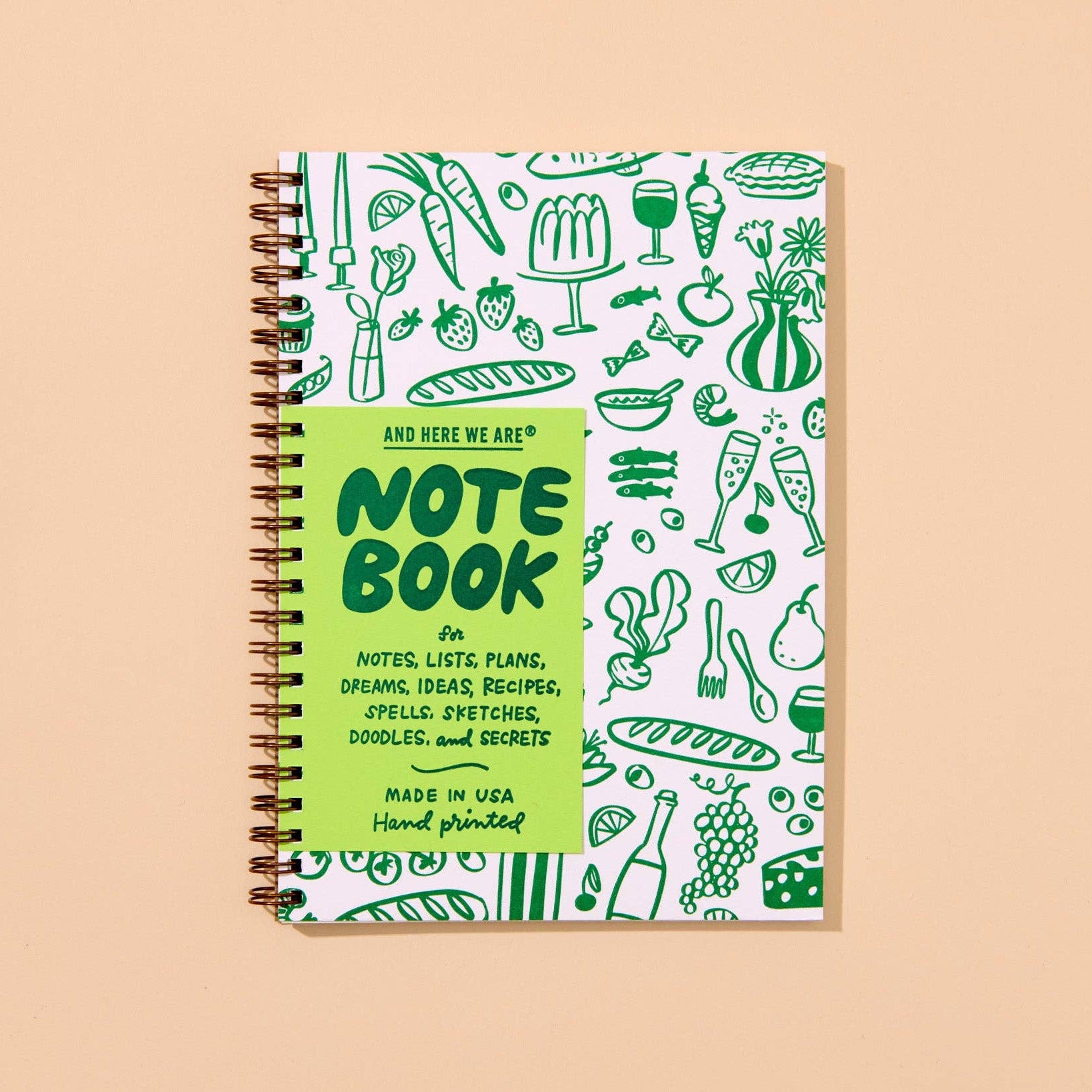 nspired by mid-century dinner parties, this modern letterpress A5 spiral-bound notebook features line art icons of food and home. 48 lined pages, hand printed and assembled in Columbus, Ohio, USA.
Details:
Spiral bound notebook with gold colored coil
A5 size (5.8” x 8.25”)