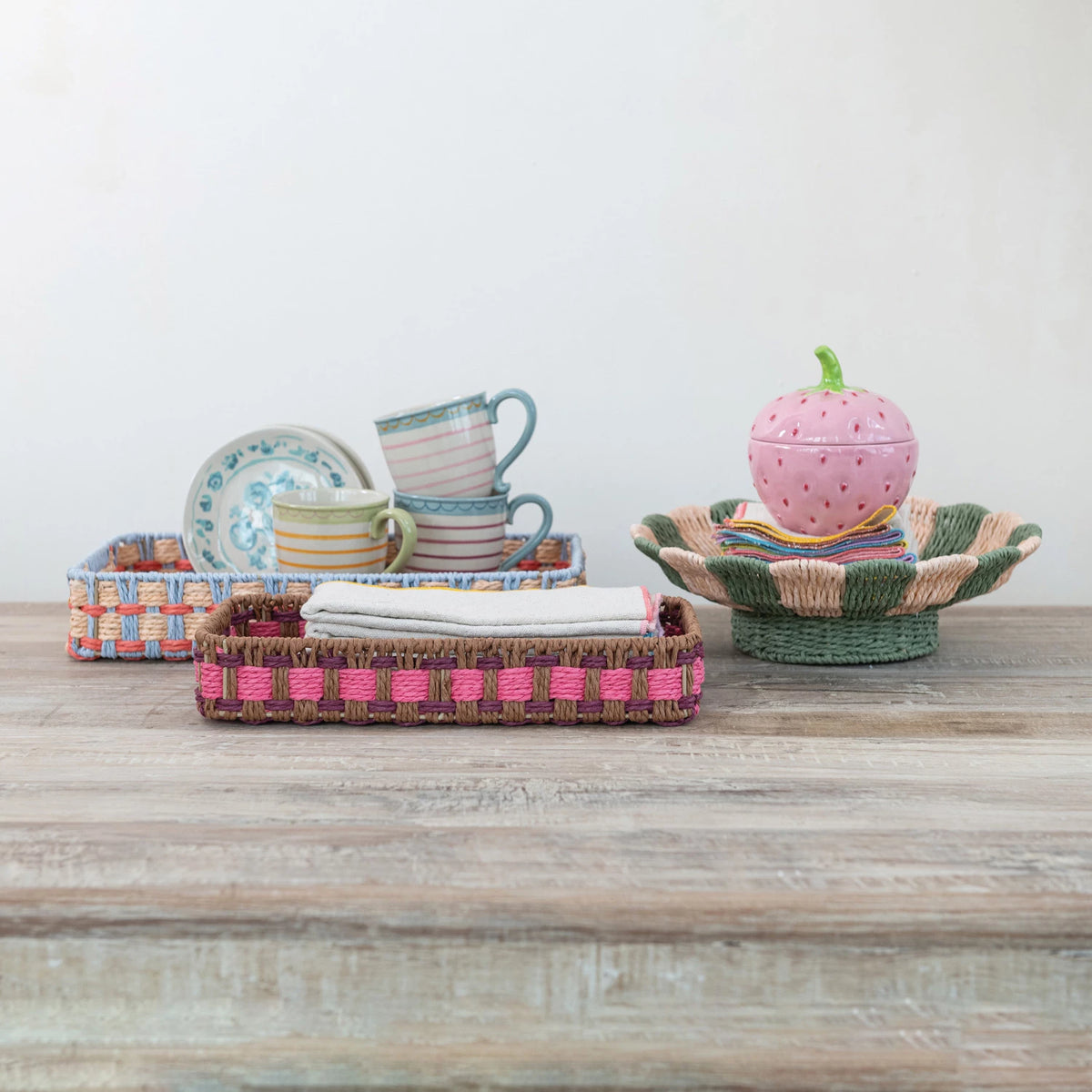 Add a touch of whimsy to your home with our Decorative Woven Paper Rope Scalloped Footed Bowl. Made from durable, eco-friendly paper rope and featuring playful stripes, this bowl is perfect for holding small items or displaying as a unique piece of decor.