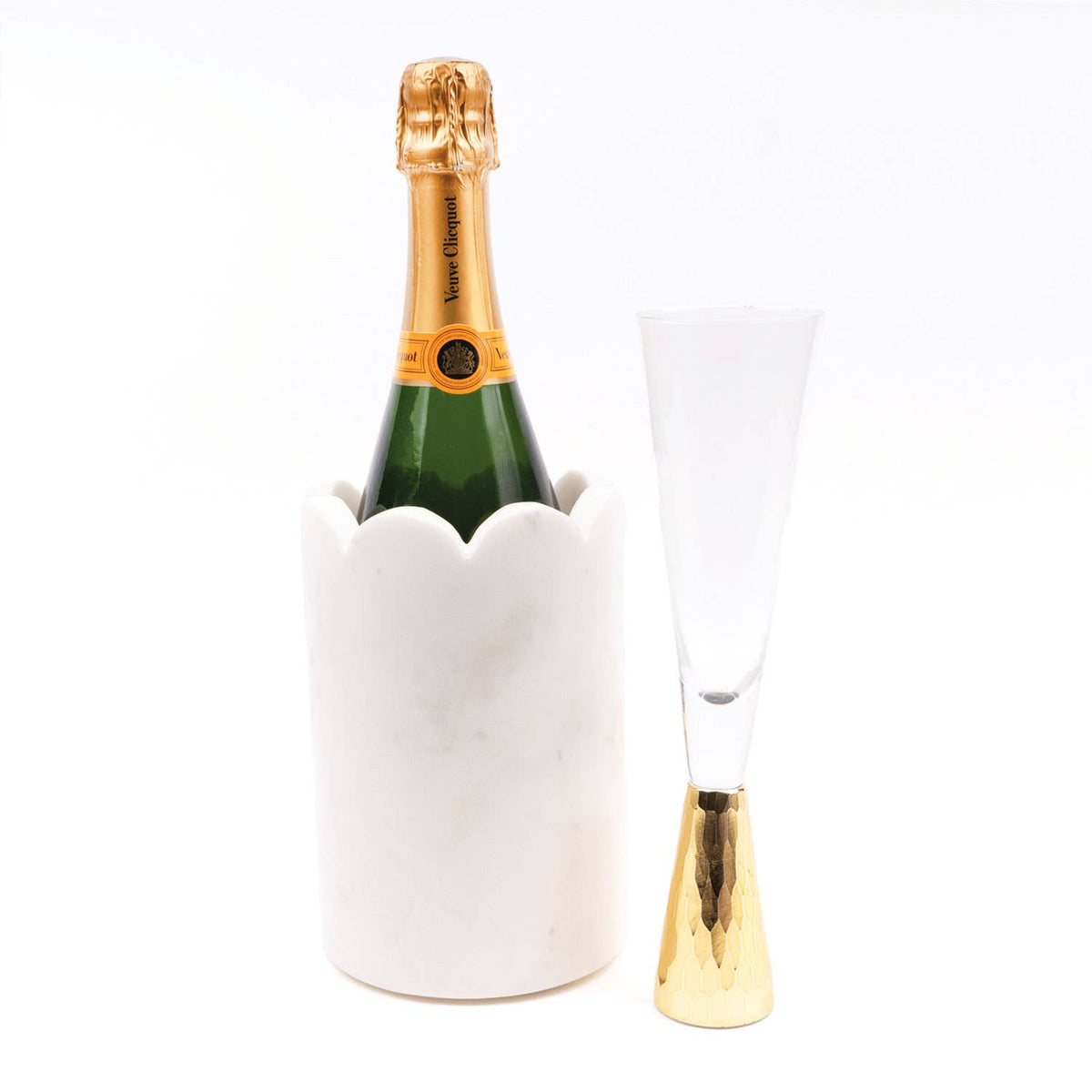 Serve your favorite beverages in style with our White Scalloped Marble Chiller, a handcrafted piece that combines elegance, functionality, and timeless design. Made from luxurious white marble, this chiller features delicate scalloped edges, adding a sophisticated touch to your table or bar setup. Perfectly sized to fit a standard 750ml wine, champagne, or sparkling water bottle, it keeps drinks chilled while providing a striking presentation for entertaining.