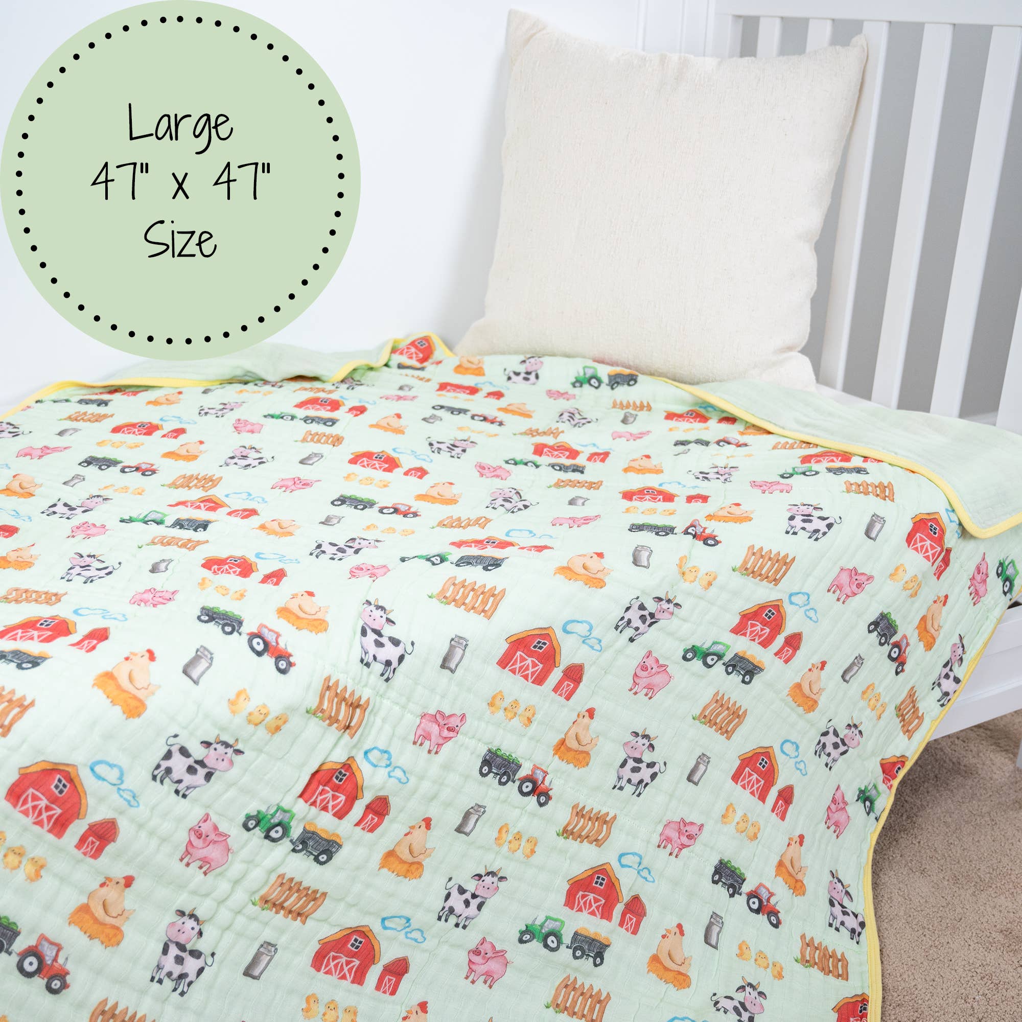 Children's quilt with farm-themed pattern on a bed