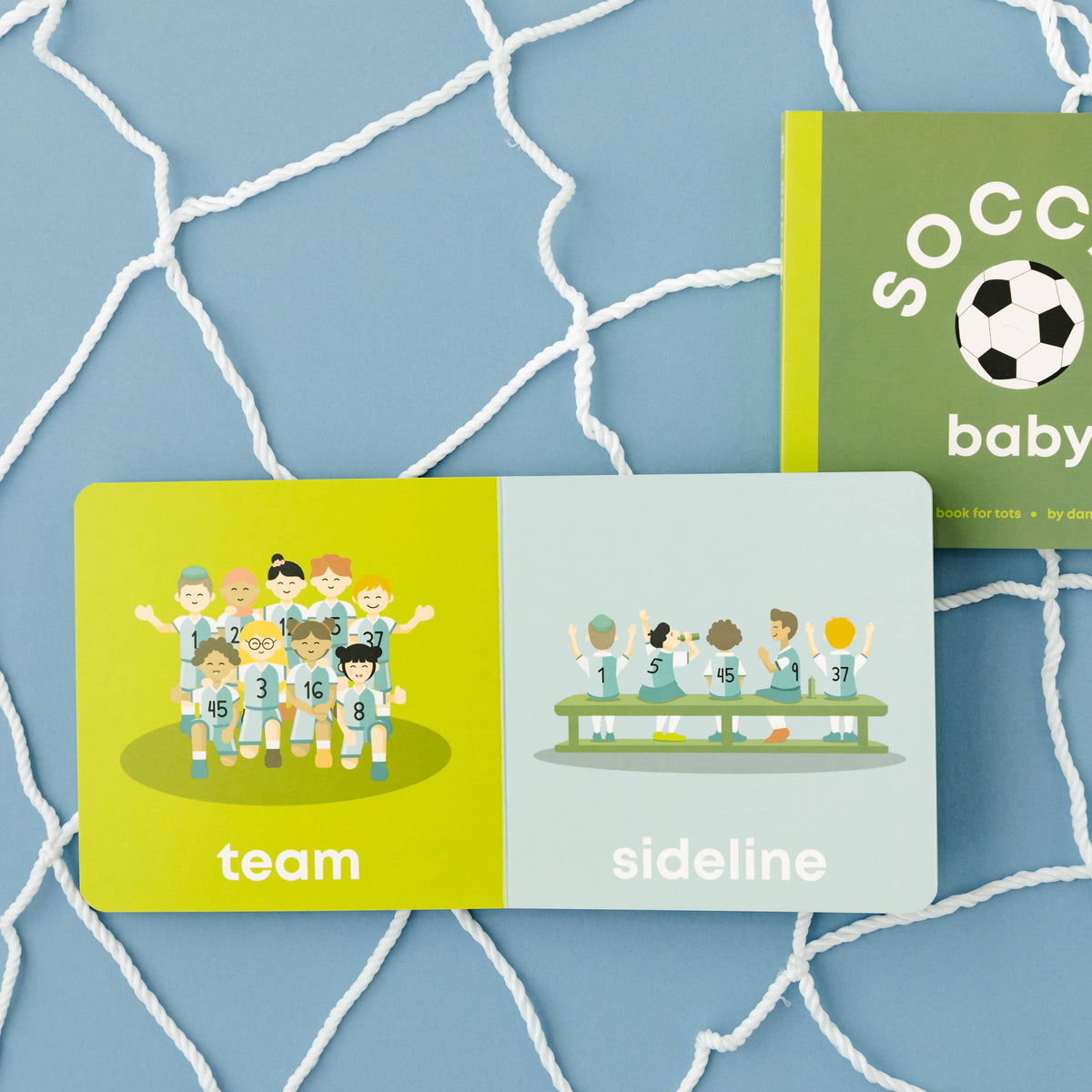 Two children's books titled 'team', 'sideline', and 'SOCCER baby' on a blue textured background.