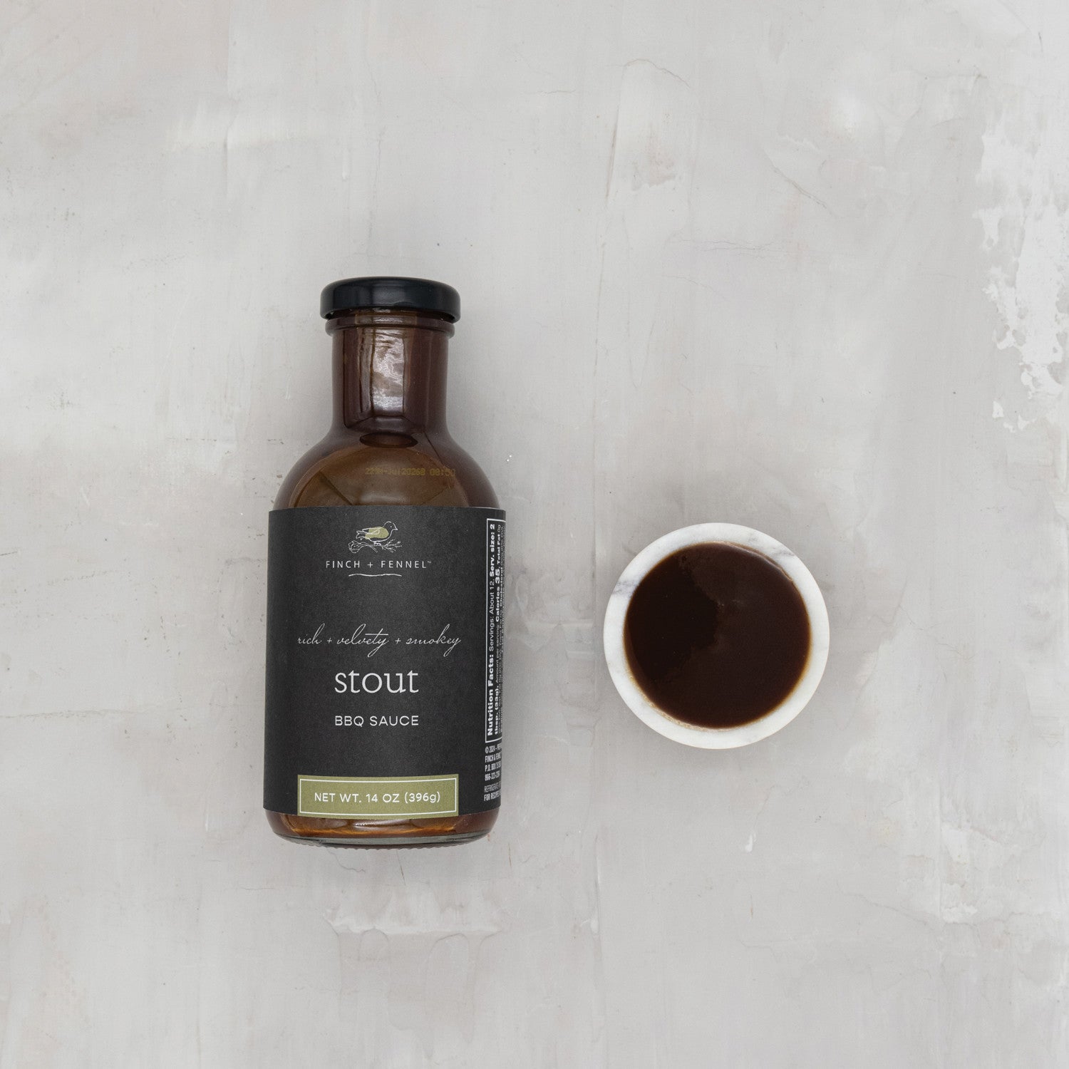 Elevate your grilling game with our 14 oz. Stout BBQ Sauce. This rich and savory sauce is infused with dark stout beer, creating a deep, complex flavor profile that perfectly complements ribs, pulled pork, and chicken. It has a thick, luscious consistency and a smoky finish that will make it your go-to barbecue companion.